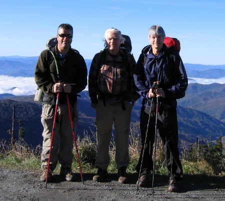 Three hikers prepared for adventure