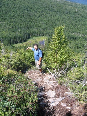 Craig points out the trail going over a cliff